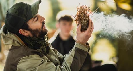 Bushman Rob making fire.