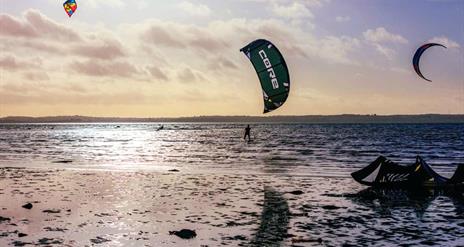 Kite surfers on the water