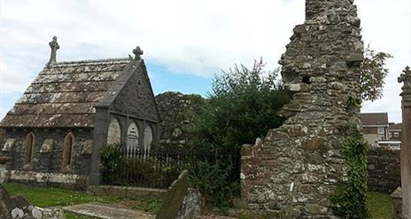 Photograph of the Movilla Abbey, grave stones and ruins