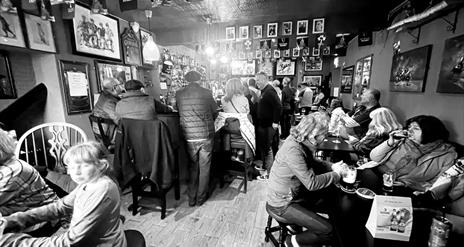 Bar with people drinking at tables