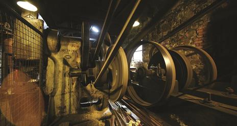 Industrial belts in an old stone mill.