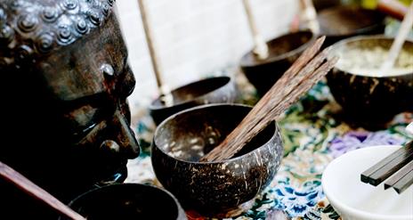 Statue and bowls with incense