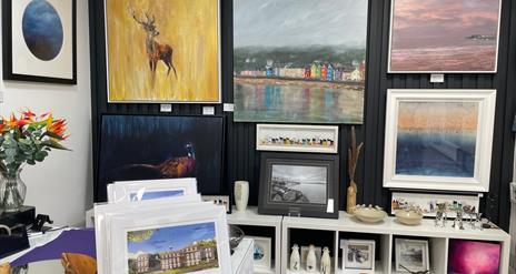 Display of various sizes of wall mounted art