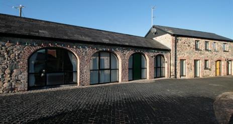 image of the arched windows in a long building