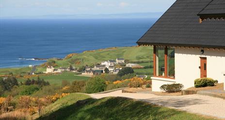 One of our lodges along with the view of the coast.