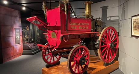 Red vintage pull along fire carriage branded Carrickfergus Fire Brigade