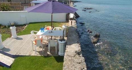 Decking and seating area by the sea