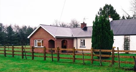 Outside image of house with wooden fence