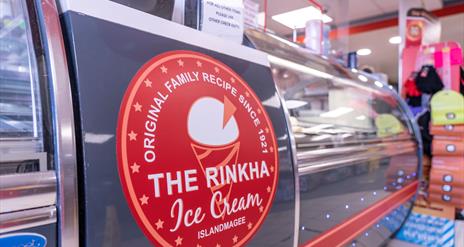 Ice cream serving counter with The Rinkha ice cream logo