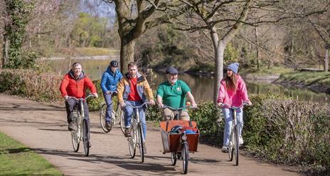 Steven from Hometown Tours guides 4 tourists along Belfast's beautiful riverside greenways as part of an urban bike tour