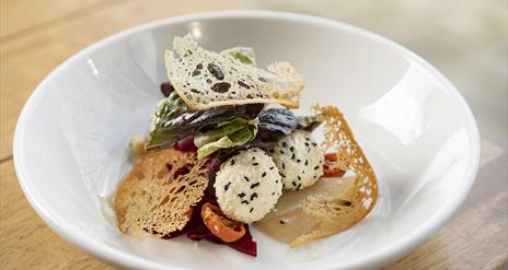 A plate of food on a restaurant table