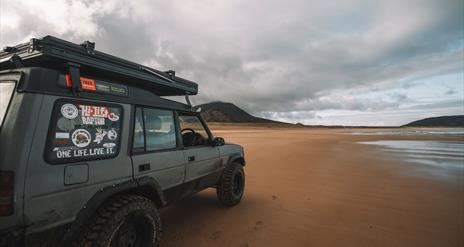 Land Rover Parked on Beach