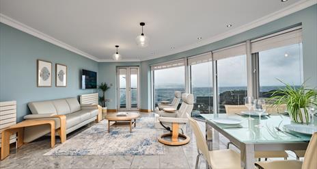 Picture of open plan kitchen diner looking out to Portstewart Harbour and the sea