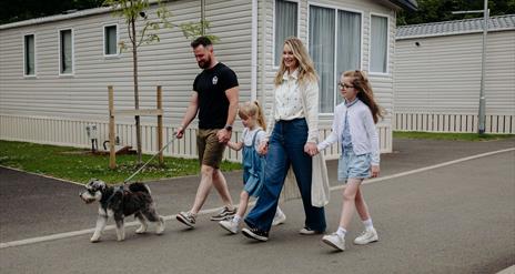 family walking dog