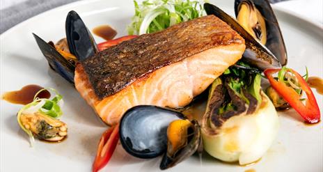 A plate of pan-seared Glenarm salmon, with Strangford Lough mussels and red chilli.