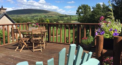 View of Knocklayde and al fresco dining area.