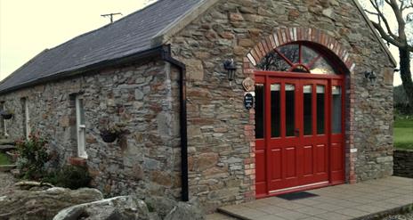 Mill Cottage showing red double doors