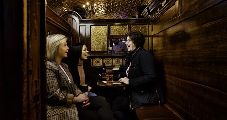 Group of friends around table at McConville's Bar Portadown