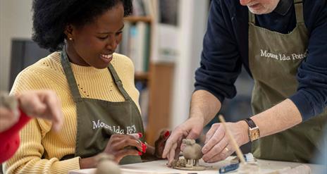 Potter Trevor Woods provides hands-on instruction during the Handmade to Last experience
