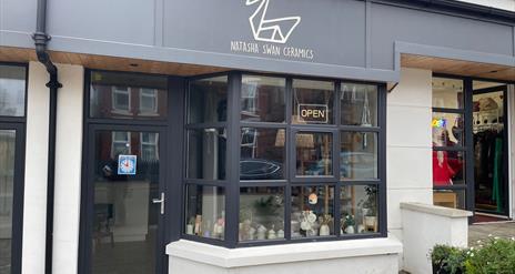 Black and white exterior premises of Natasha Swan Ceramics with window display
