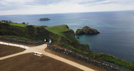 people standing on the viewing platform at Portaneevy View Point. Sheep Island and Carrick a rede island can be seen in the background