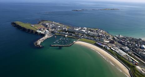 Aerial view of Portrush East strand peninsula