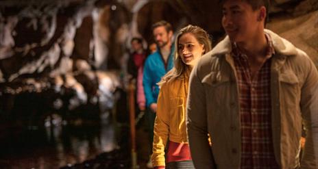 Tour group enjoys walking through the Marble Arch Cave underground experience