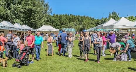 shoppers enjoying benone market