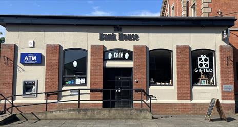 Building exterior of the red brick Bank House Cafe