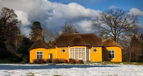 Image credit: Alan Hopps
Derrymore house. A bright yellow cottage with a thatched roof.