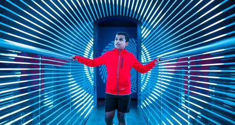 A mesmerising exhibition at W5 with a young boy walking through an optical illusion