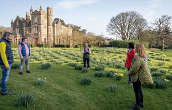 Group standing outside with Elmfield Estate in the background enjoying the Journey into Stillness experience