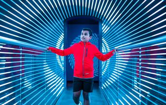 A mesmerising exhibition at W5 with a young boy walking through an optical illusion