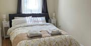 King bed infront of window