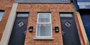 Exterior view of front apartment doors.