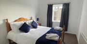 Spacious double bedroom to the back of the cottage with views of the countryside.