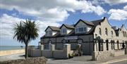 Exterior of the Harbour House Inn on a sunny day
