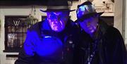 two figures dressed as spooky undertakers at the causeway hotel