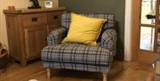 Photo of armchair in the corner of the living room
