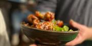 Chicken wings on plate and being served