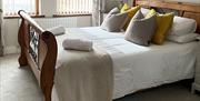 Photo of the downstairs double bedroom with king sized bed