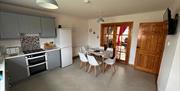 interior of kitchen and dining area at Primrose Seaside Escape