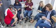 group of 5 ladies in workshop making Textured Bangles