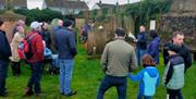 Alastair Donaghy leading a Ballymena Walking Tour with tour participants standing in a graveyard