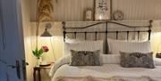 king size bed bedroom of the pink cottage