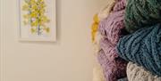 shelves at Bramble Green holding a range of colourful knitwear