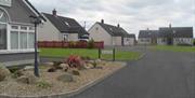 Image shows view of all the Good Cottages with sign to Reception