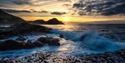 waves lap over the basalt stones at the giants causeway