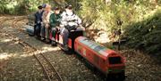 a group of men on the small train