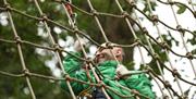 Man climbing cargo net